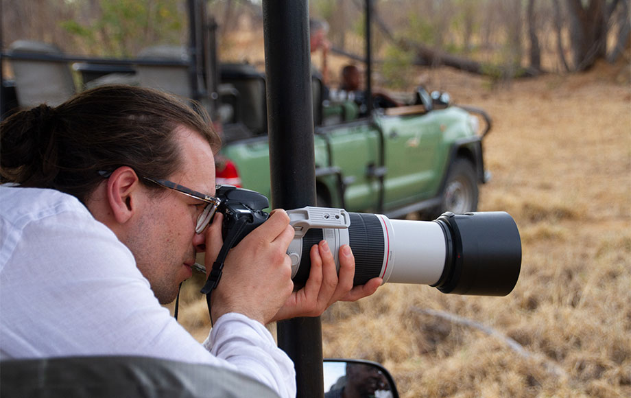 James photographing lions in Hwange