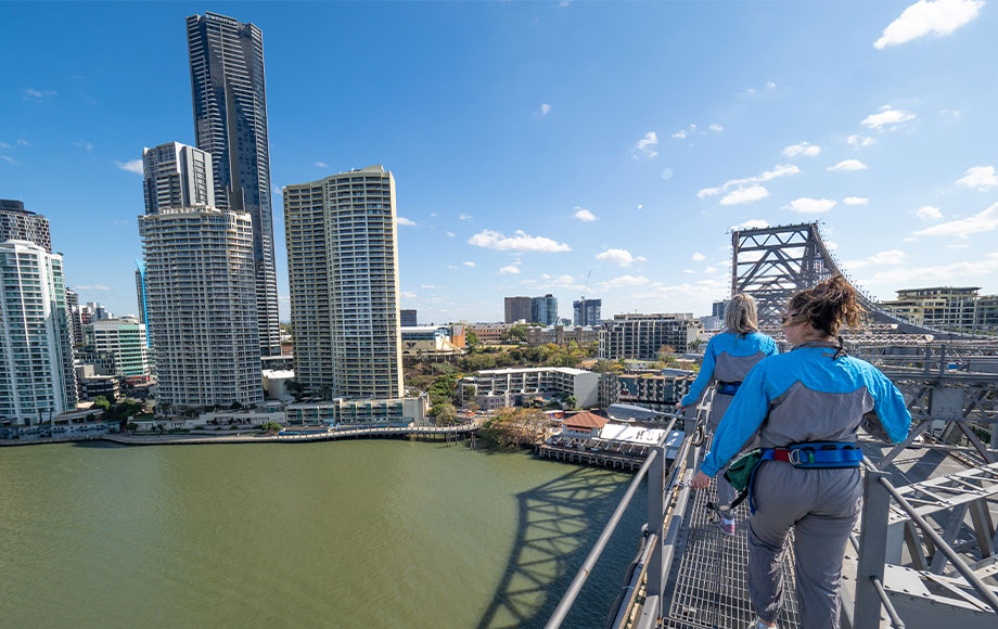 Brisbane city sky line walking across bridge