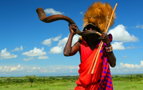 Masai Warrior blowing horn in Kenya
